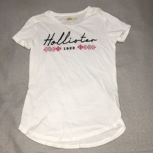 White Hollister tee.